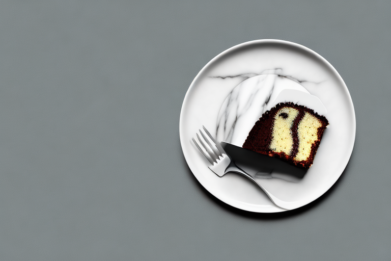 A vegan marble cake on a plate with a fork and knife